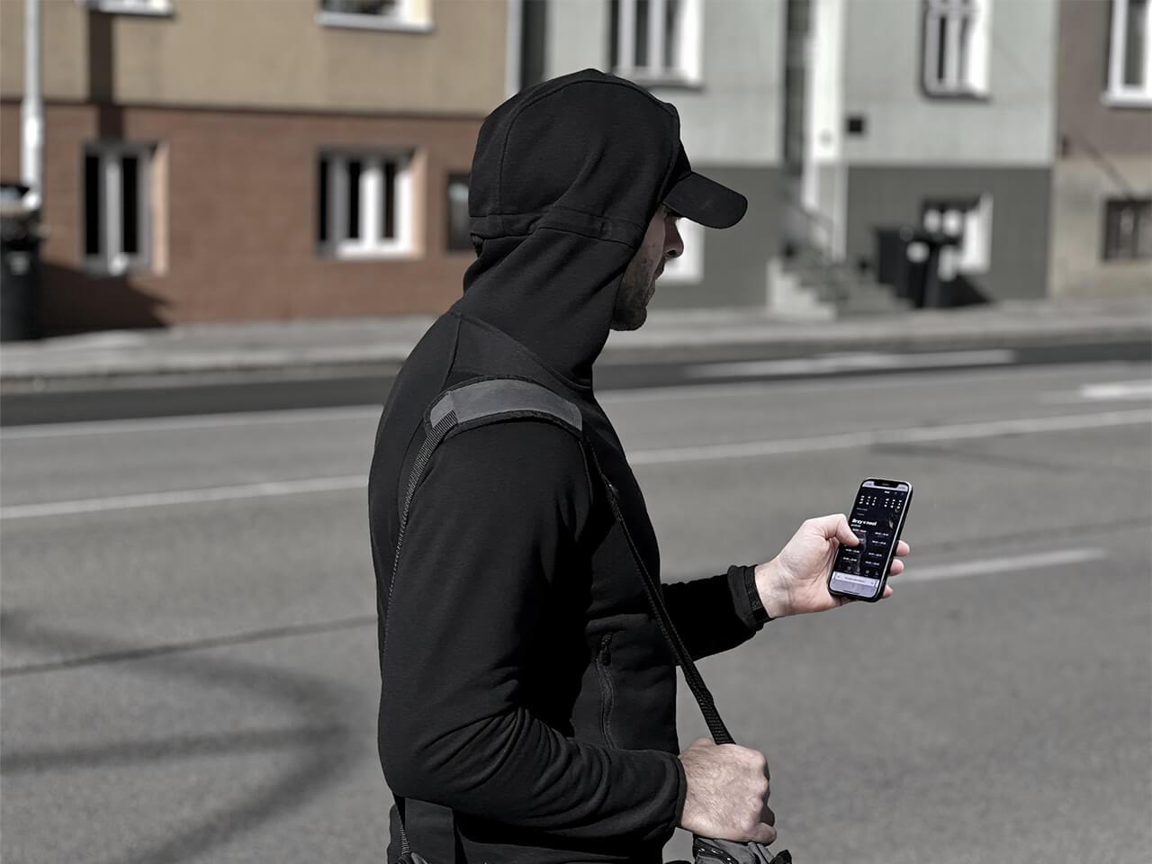 Person using a mobile phone to book a time slot at Solospace Gym, navigating through the scheduling app to select available session times